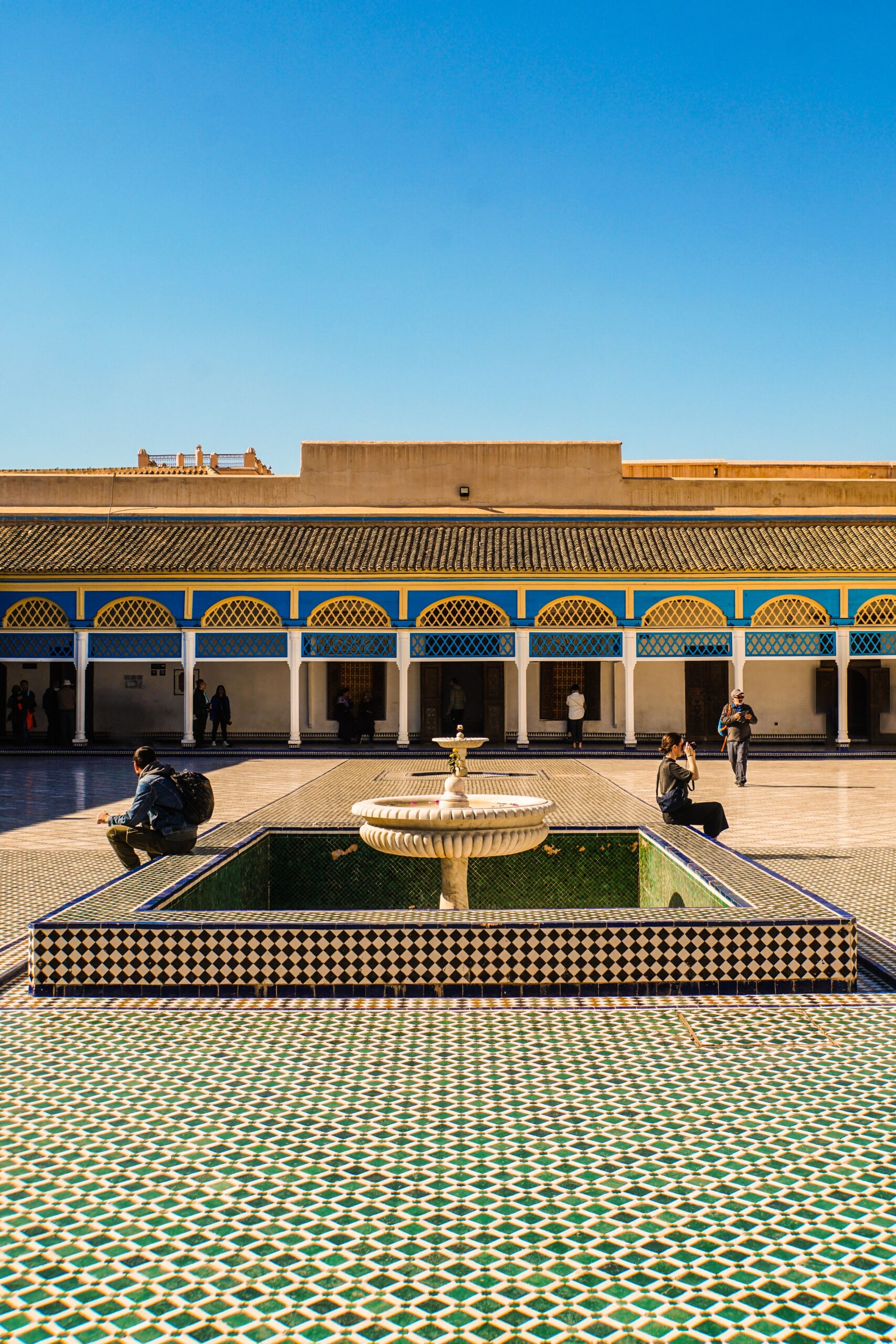 Beautiful courtyard with a traditional fountain at Bahia Palace, a landmark in Marrakech, Morocco.