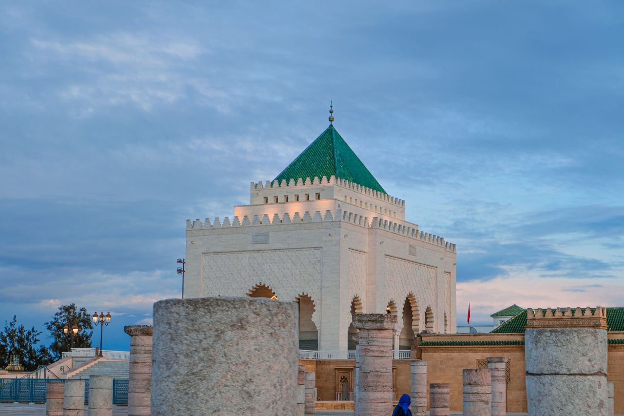 Historic Hassan Tower with Mausoleum in Rabat, Morocco at sunset, capturing Moroccan architecture.
