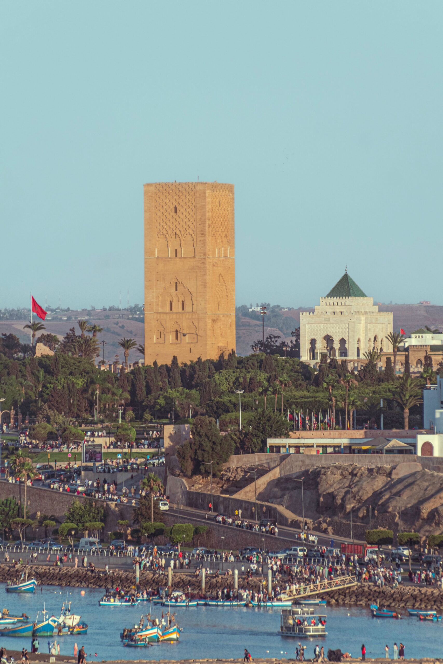 View of the historic Hassan Tower and the Mausoleum of Mohammed V in Rabat, Morocco during sunset.