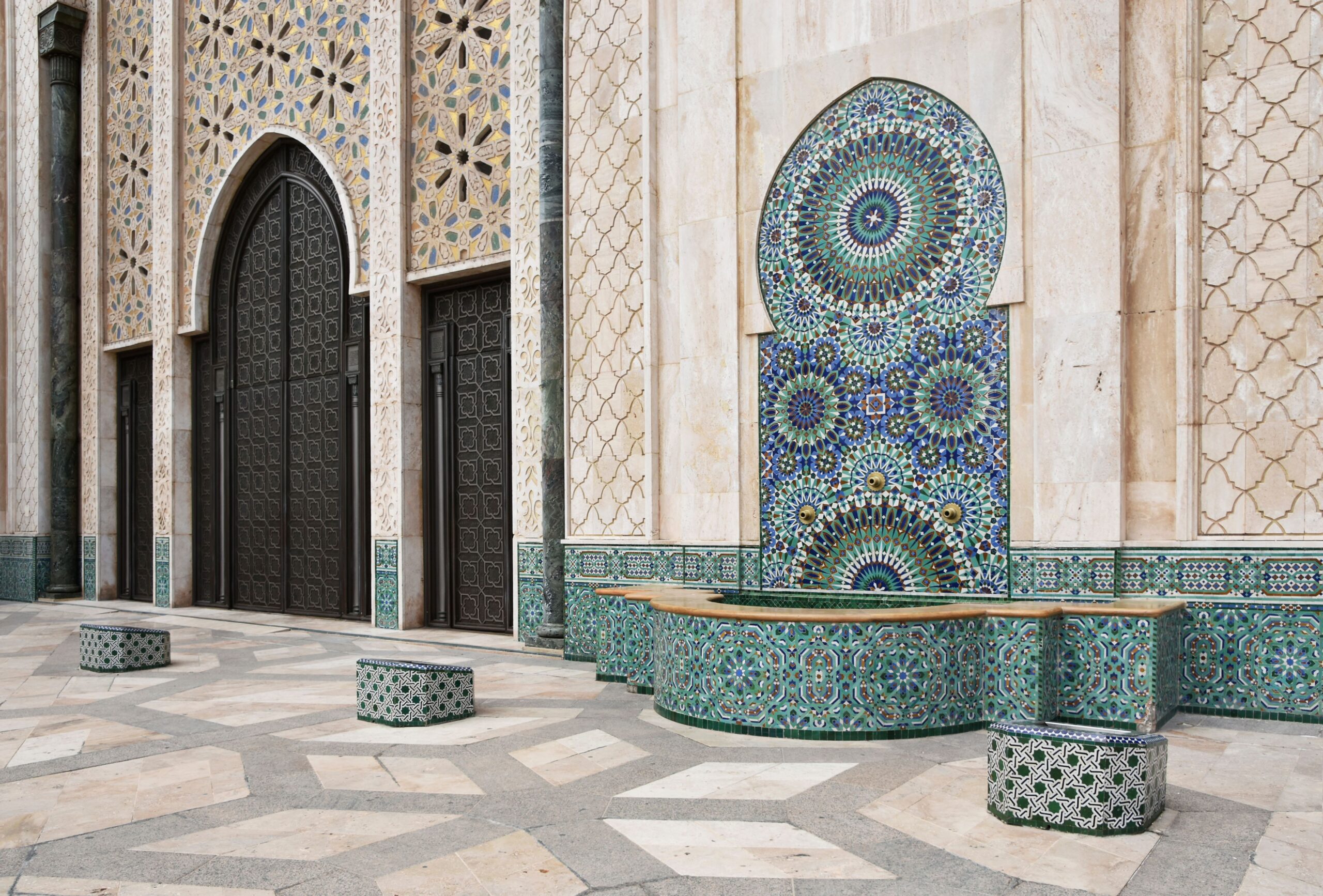 Explore the ornate mosaics and Moorish architecture of a mosque in Casablanca, Morocco.