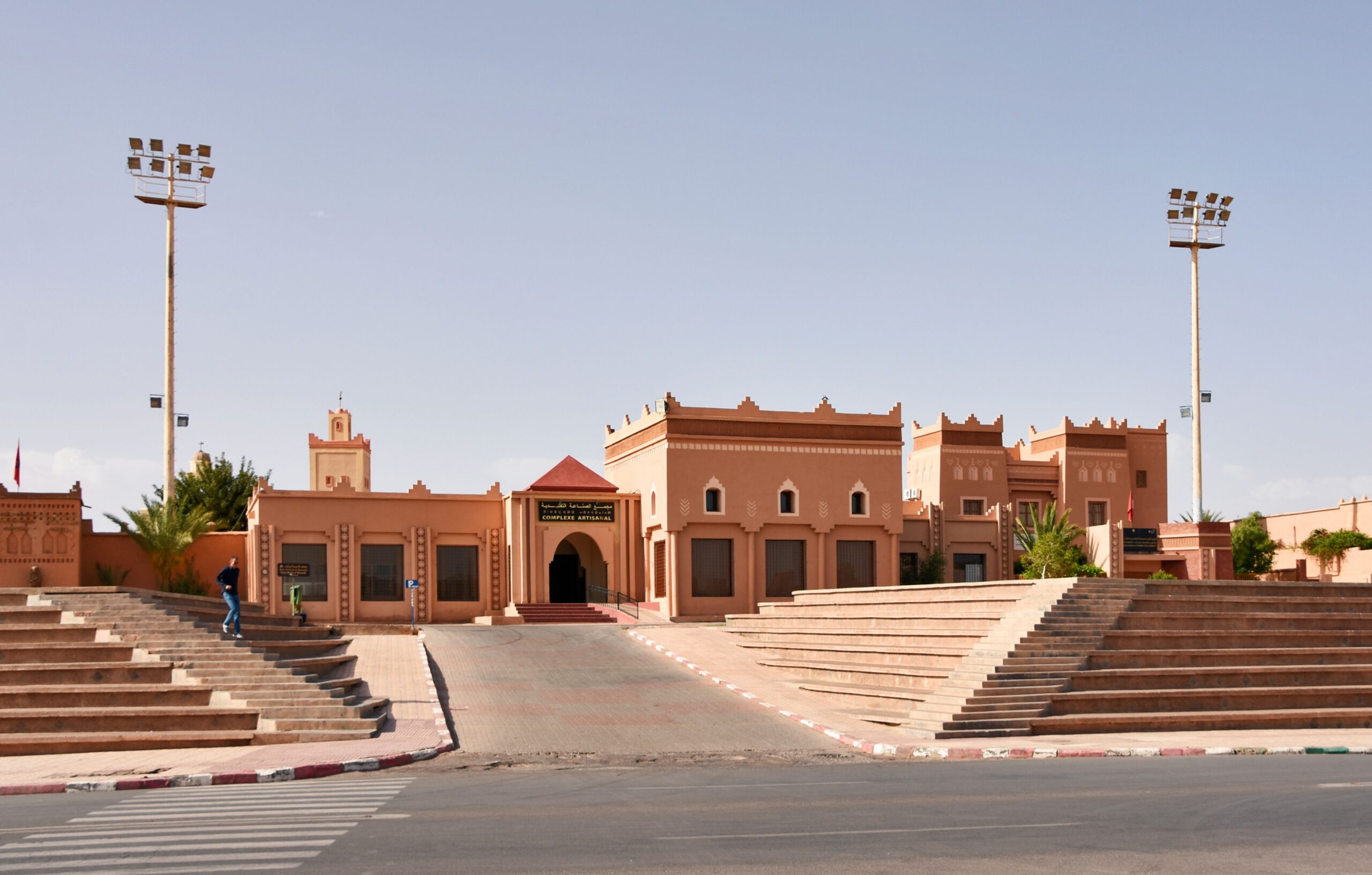 Historic Moroccan buildings with clear sky in Ouarzazate, showcasing traditional design elements.